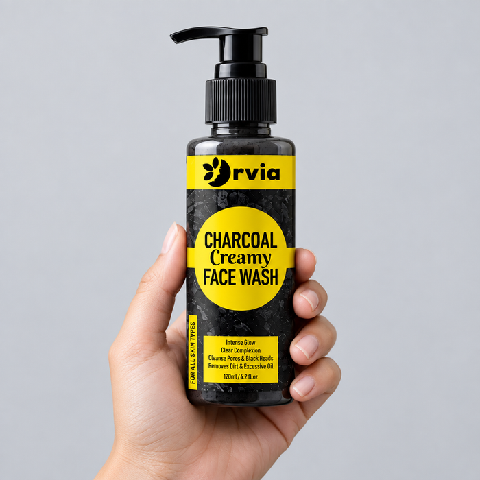 Charcoal face wash held in hand